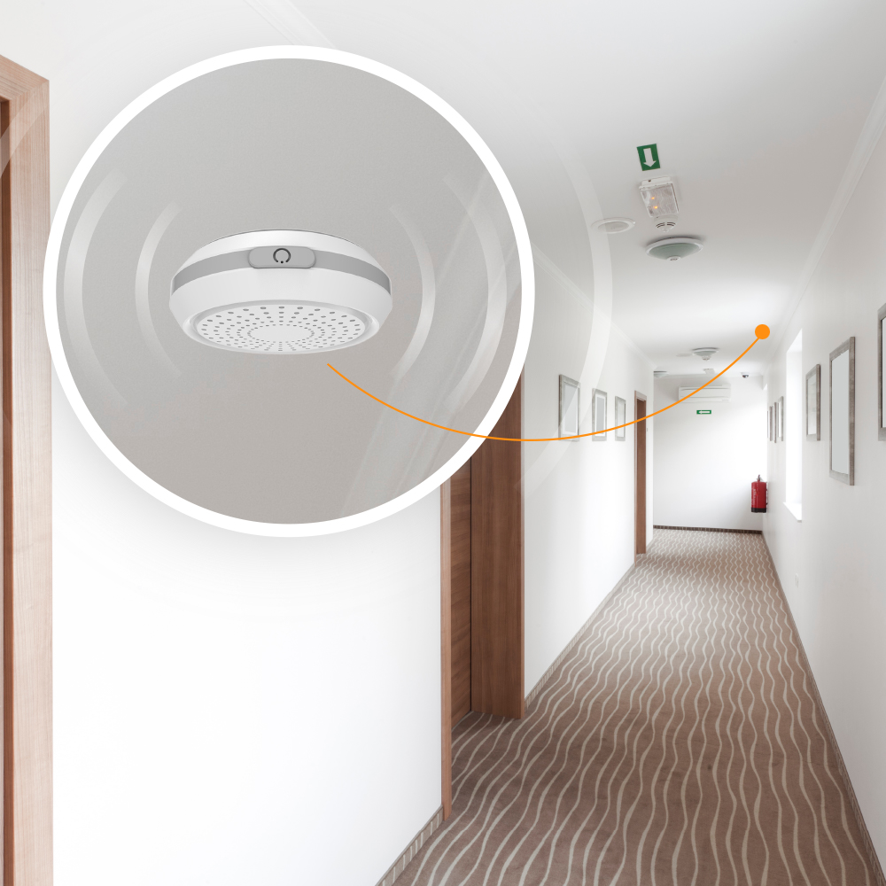 A small beacon installed on a ceiling to for monitoring