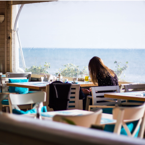 girl sitting alone in a restaurant