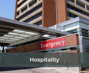 Outside building of a hospital with an emergency sign